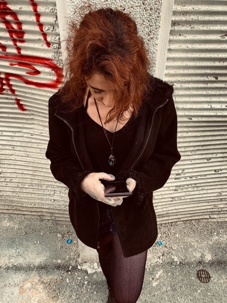 Iranian woman looking at phone
