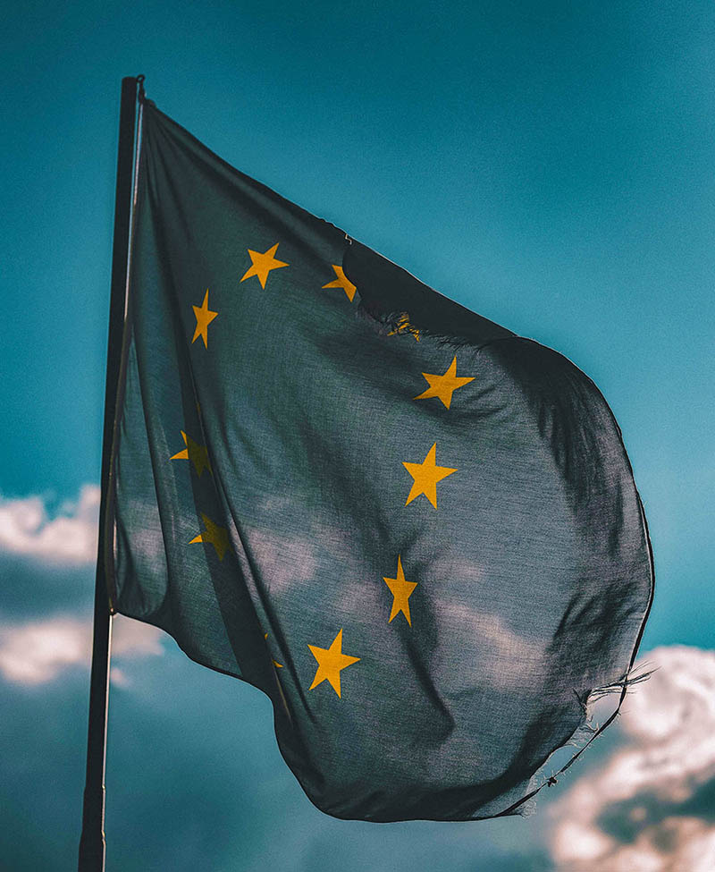 european union flag with a blue sky behind